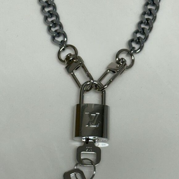Louis Vuitton Gold Lock-N-Key Necklace Jewelry - Silver Louis Vuitton lock-n-key set with unbranded 18" silver plated chain.